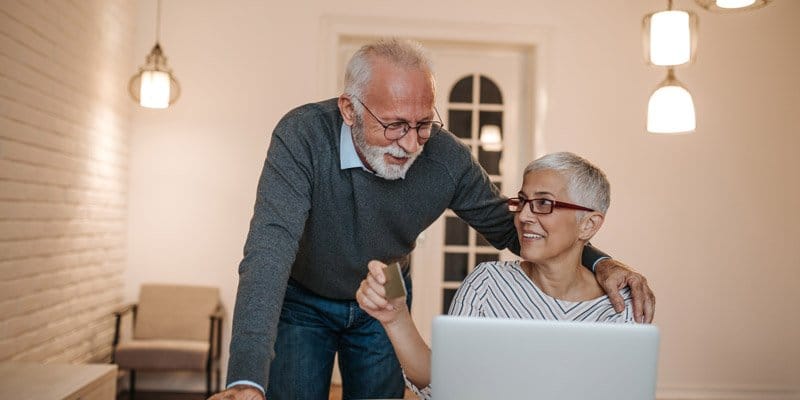 Elderly couple using computer